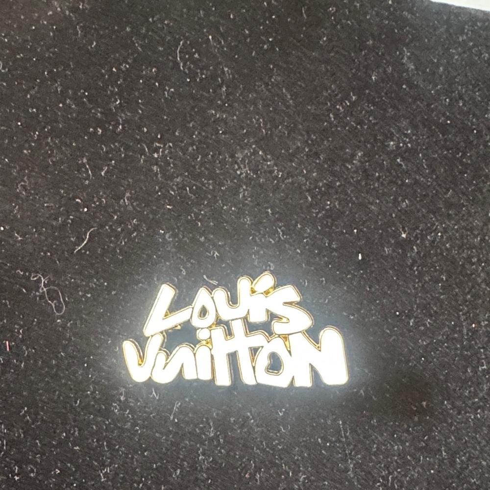 Louis Vuitton pin / brooch, Gold Script Logo white enamel signed in back